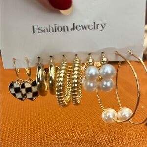 Gold and Black Earrings Set. Five pairs of costume jewelry earrings.